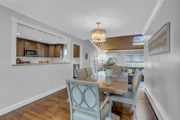 Chandelier, Dining room, Interior, Kitchen, Recessed Lighting, Stainless Steel Appliances, Wood Texture Flooring