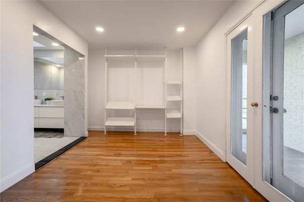 Interior, Marble Walls, Recessed Lighting, Walk-in Closets, Wood Texture Flooring
