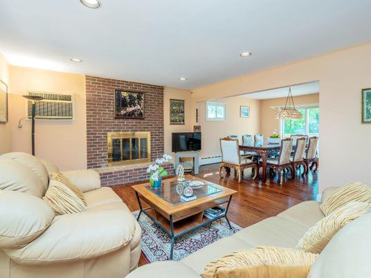Dining room, Fireplace, Interior, Living room, Recessed Lighting, Stone Walls, Wood Texture Flooring
