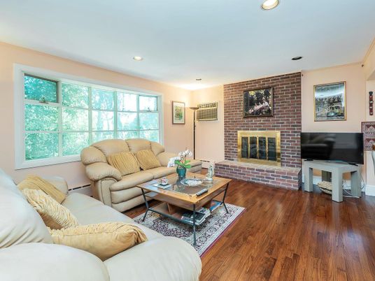 Fireplace, Interior, Living room, Recessed Lighting, Stone Walls, Wood Texture Flooring