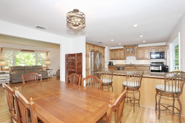 Dining room, Interior, Kitchen, Living room, Recessed Lighting, Stainless Steel Appliances, Wood Texture Flooring