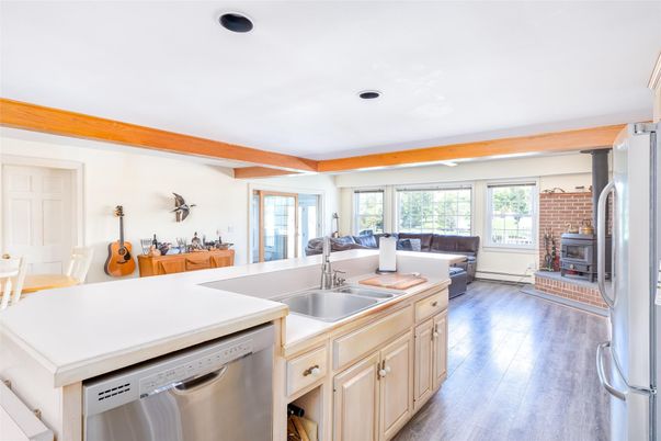 Fireplace, Interior, Kitchen, Living room, Recessed Lighting, Stainless Steel Appliances, Wood Texture Flooring