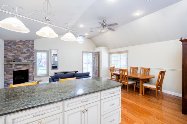 Dining room, Fireplace, Interior, Pendant Lights, Recessed Lighting, Stone Walls, Wood Texture Flooring
