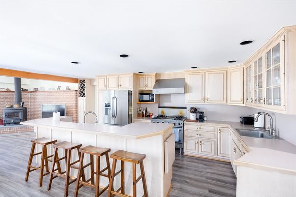 Interior, Kitchen, Recessed Lighting, Stainless Steel Appliances, Stone Walls, Wood Texture Flooring