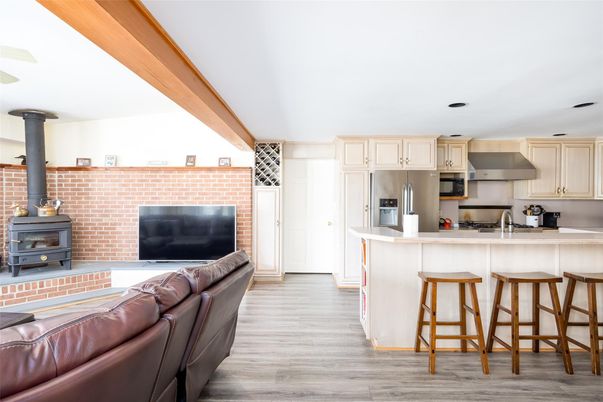 Fireplace, Interior, Kitchen, Living room, Stainless Steel Appliances, Stone Walls, Wood Texture Flooring