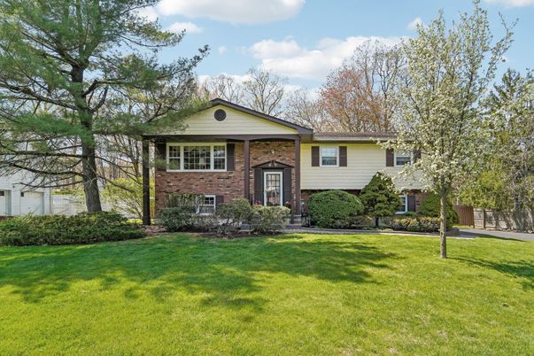 Backyard, Exterior, Facade, Brick Facade, Raised Ranch