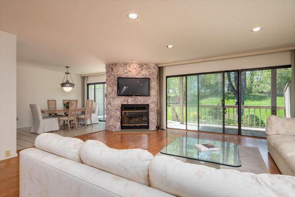 Dining room, Fireplace, Interior, Living room, Pendant Lights, Recessed Lighting, Stone Walls, Wood Texture Flooring