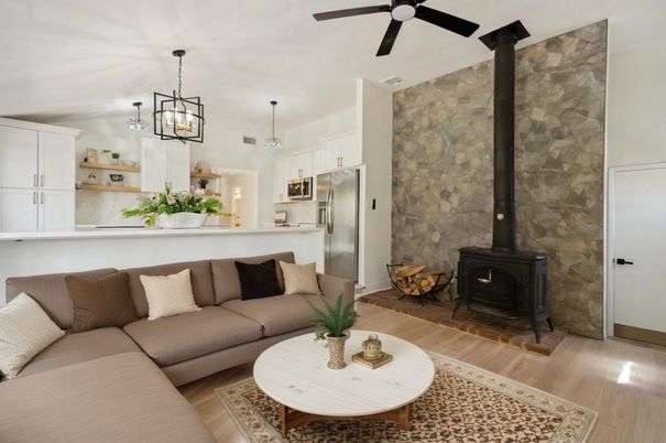 Fireplace, Interior, Kitchen, Living room, Pendant Lights, Stainless Steel Appliances, Stone Walls, Wood Texture Flooring