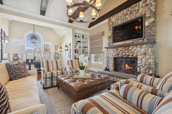 Chandelier, Fireplace, Interior, Living room, Pendant Lights, Recessed Lighting, Stone Walls, Wooden Beams