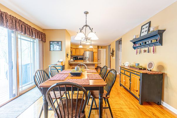 Chandelier, Dining room, Interior, Kitchen, Pendant Lights, Stainless Steel Appliances, Wood Texture Flooring