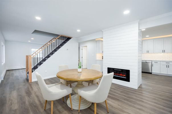 Dining room, Fireplace, Interior, Kitchen, Recessed Lighting, Stainless Steel Appliances, Wood Texture Flooring