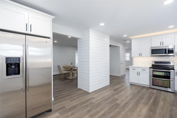 Dining room, Interior, Kitchen, Recessed Lighting, Stainless Steel Appliances, Wood Texture Flooring
