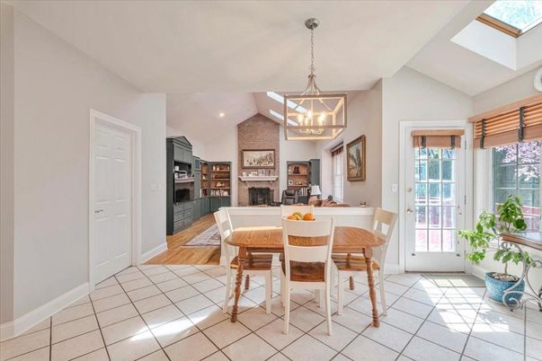 Dining room, Fireplace, Interior, Kitchen, Pendant Lights, Recessed Lighting, Stainless Steel Appliances, Stone Walls, Wood Texture Flooring