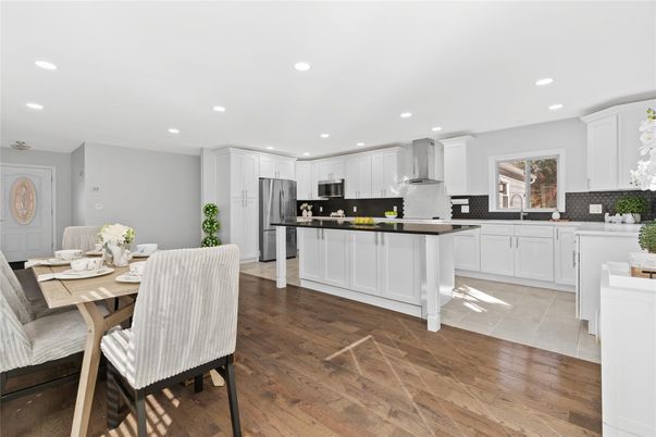 Dining room, Interior, Kitchen, Recessed Lighting, Stainless Steel Appliances, Wood Texture Flooring