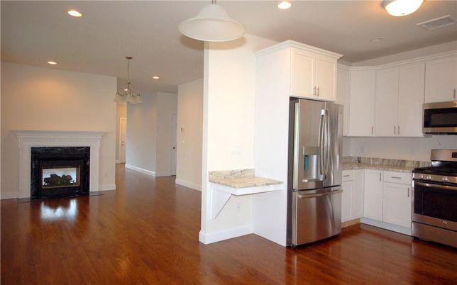 Fireplace, Interior, Kitchen, Pendant Lights, Recessed Lighting, Stainless Steel Appliances, Wood Texture Flooring