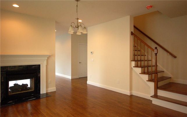 Chandelier, Empty room, Fireplace, Interior, Recessed Lighting, Wood Texture Flooring