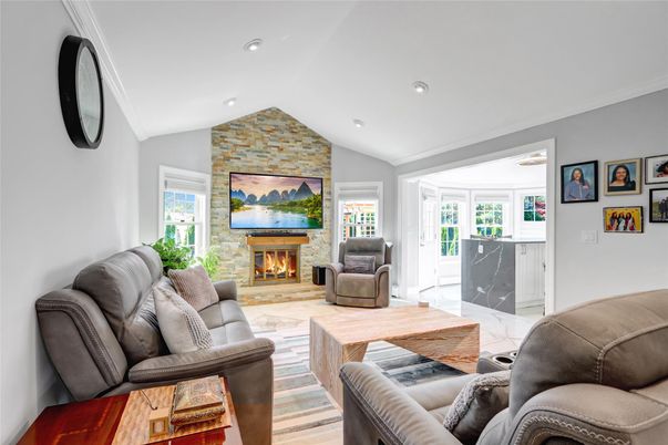 Fireplace, Interior, Living room, Recessed Lighting, Stone Walls, Wood Texture Flooring