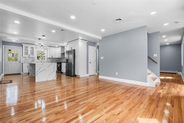 Interior, Kitchen, Marble Walls, Pendant Lights, Recessed Lighting, Stainless Steel Appliances, Wood Texture Flooring