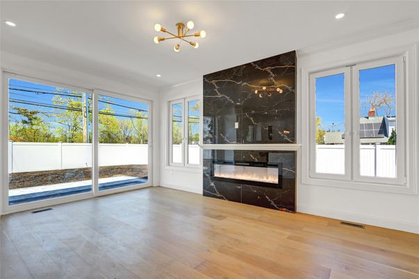 Empty room, Fireplace, Interior, Marble Walls, Pendant Lights, Recessed Lighting, Wood Texture Flooring