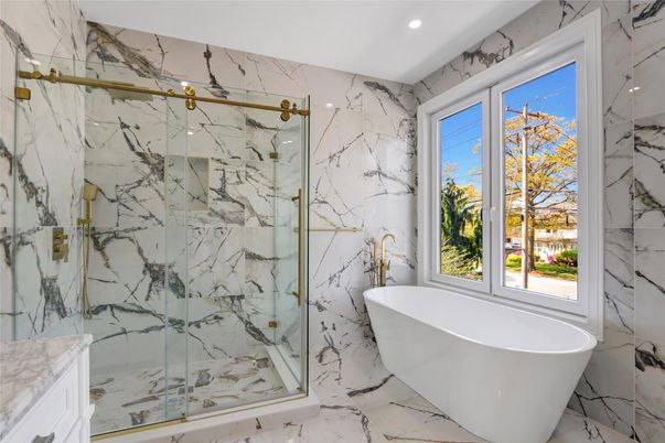 Bathroom, Free Standing Baths, Glass Shower, Interior, Marble, Marble Walls, Recessed Lighting