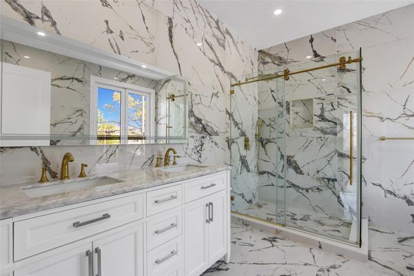Bathroom, Dual Sink Vanities, Glass Shower, Interior, Marble, Marble Walls, Recessed Lighting