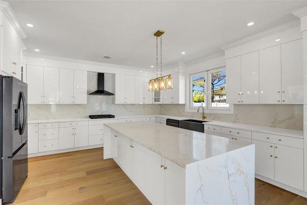 Interior, Kitchen, Marble Walls, Pendant Lights, Recessed Lighting, Stainless Steel Appliances, Wood Texture Flooring