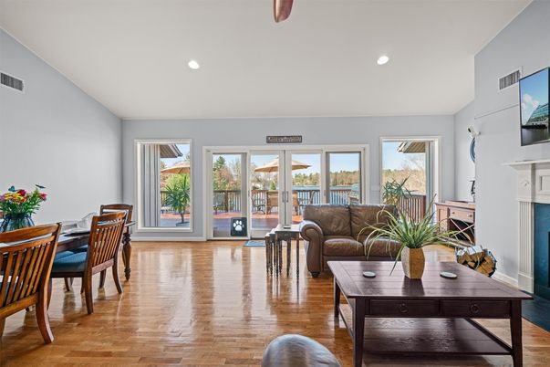 Dining room, Fireplace, Interior, Living room, Recessed Lighting, Wood Texture Flooring