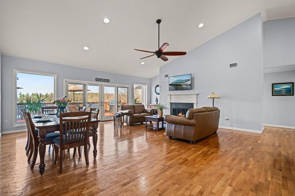 Dining room, Fireplace, Interior, Living room, Recessed Lighting, Wood Texture Flooring