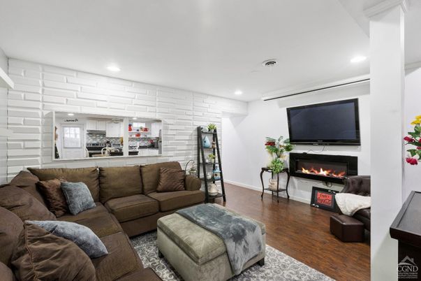 Fireplace, Interior, Living room, Recessed Lighting, Stone Walls, Wood Texture Flooring