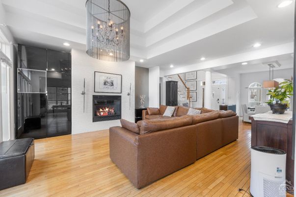 Chandelier, Fireplace, Interior, Living room, Pendant Lights, Recessed Lighting, Wood Texture Flooring
