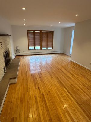 Empty room, Fireplace, Interior, Recessed Lighting, Stone Walls, Wood Texture Flooring