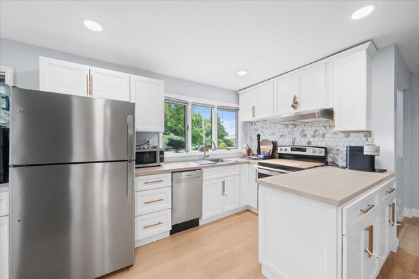 Interior, Kitchen, Recessed Lighting, Stainless Steel Appliances, Wood Texture Flooring