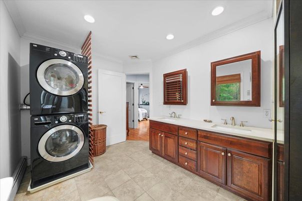 Bathroom, Dual Sink Vanities, Interior, Recessed Lighting, Utility Closets, Washer, Wood Texture Flooring