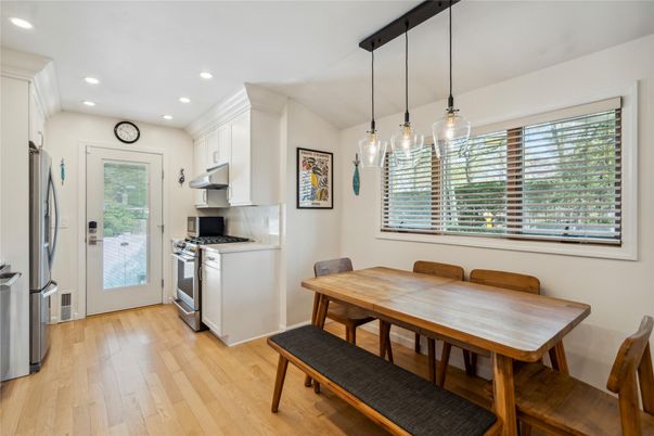 Dining room, Interior, Kitchen, Pendant Lights, Recessed Lighting, Stainless Steel Appliances, Wood Texture Flooring