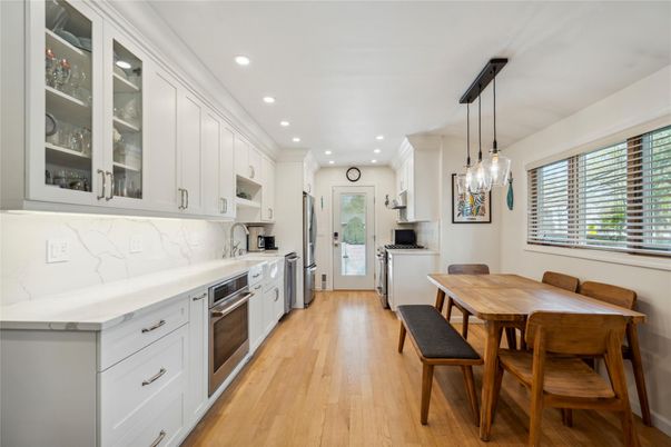 Dining room, Interior, Kitchen, Pendant Lights, Recessed Lighting, Stainless Steel Appliances, Wood Texture Flooring