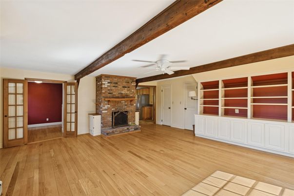 Empty room, Fireplace, Interior, Stone Walls, Wooden Beams, Wood Texture Flooring