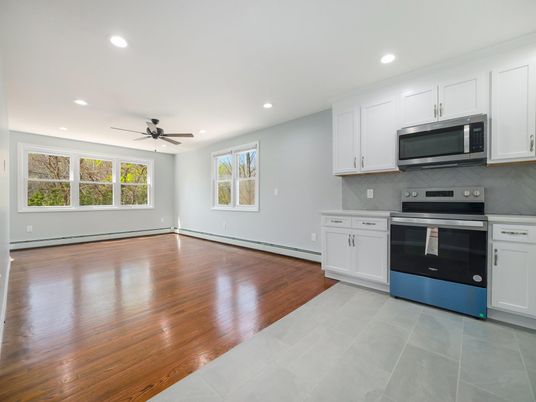 Empty room, Interior, Kitchen, Recessed Lighting, Stainless Steel Appliances, Wood Texture Flooring