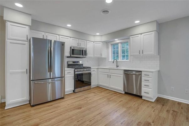 Interior, Kitchen, Recessed Lighting, Stainless Steel Appliances, Wood Texture Flooring