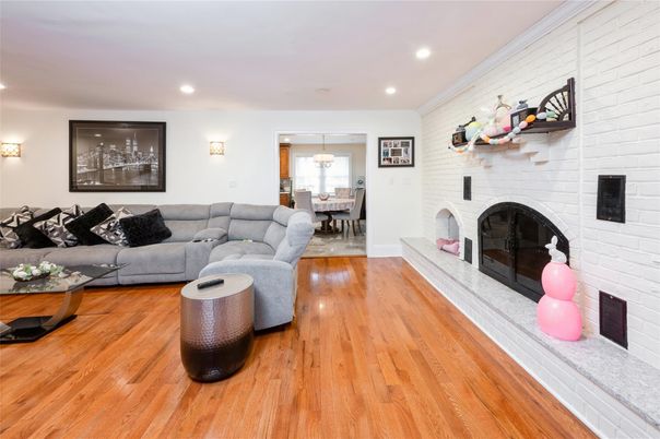 Dining room, Fireplace, Interior, Living room, Pendant Lights, Recessed Lighting, Stone Walls, Wood Texture Flooring