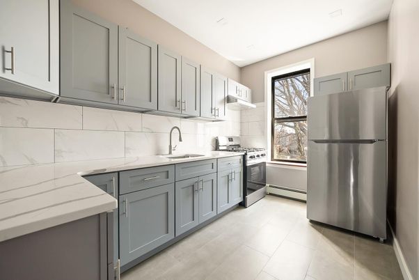 Interior, Kitchen, Marble Walls, Recessed Lighting, Stainless Steel Appliances