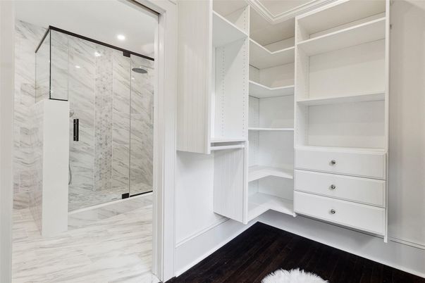 Bathroom, Glass Shower, Interior, Marble, Marble Walls, Recessed Lighting, Walk-in Closets, Wood Texture Flooring