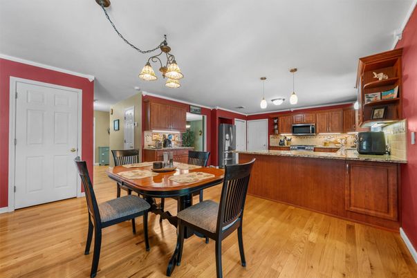 Chandelier, Dining room, Interior, Kitchen, Pendant Lights, Stainless Steel Appliances, Wood Texture Flooring