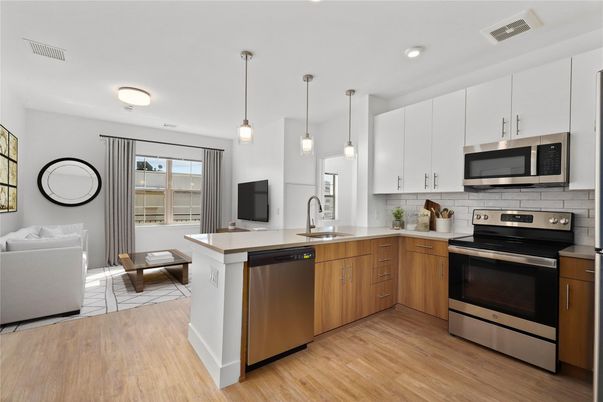 Dining room, Interior, Kitchen, Pendant Lights, Recessed Lighting, Stainless Steel Appliances, Wood Texture Flooring