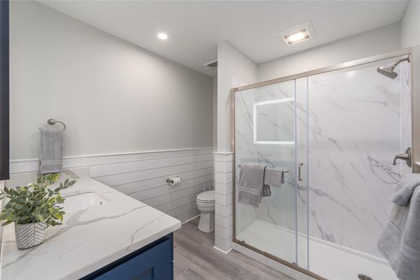 Bathroom, Glass Shower, Interior, Marble Walls, Recessed Lighting, Wood Texture Flooring