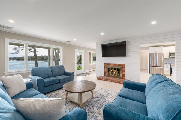 Fireplace, Interior, Kitchen, Living room, Recessed Lighting, Stainless Steel Appliances, Water, Wood Texture Flooring