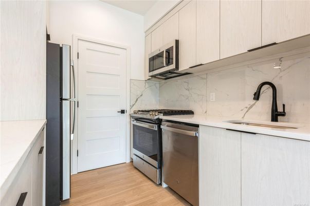 Interior, Kitchen, Marble Walls, Stainless Steel Appliances, Wood Texture Flooring