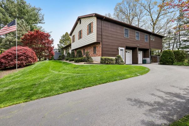 Backyard, Exterior, Facade, Brick Facade, Raised Ranch