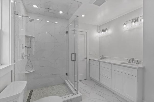 Bathroom, Dual Sink Vanities, Glass Shower, Interior, Marble, Marble Walls, Recessed Lighting