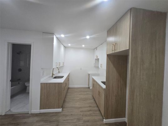 Bathroom, Dual Sink Vanities, Interior, Recessed Lighting, Wood Texture Flooring
