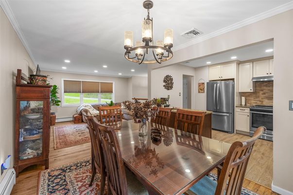 Chandelier, Dining room, Interior, Kitchen, Recessed Lighting, Stainless Steel Appliances, Wood Texture Flooring